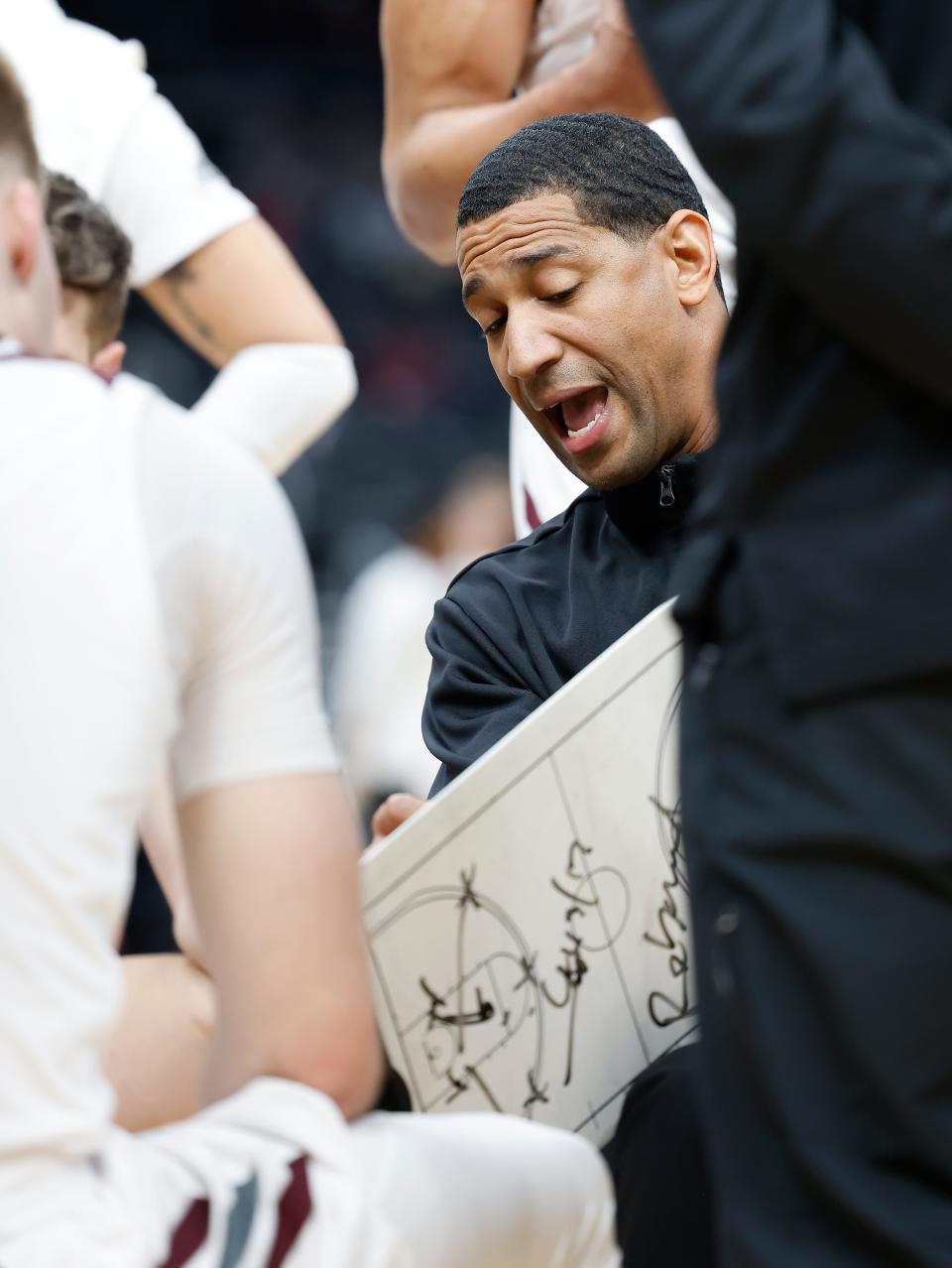 Missouri State head coach Dana Ford talks with his team during a timeout at the Missouri Valley Conference Tournament, Friday, March 4, 2022, at Enterprise Center in St. Louis. 