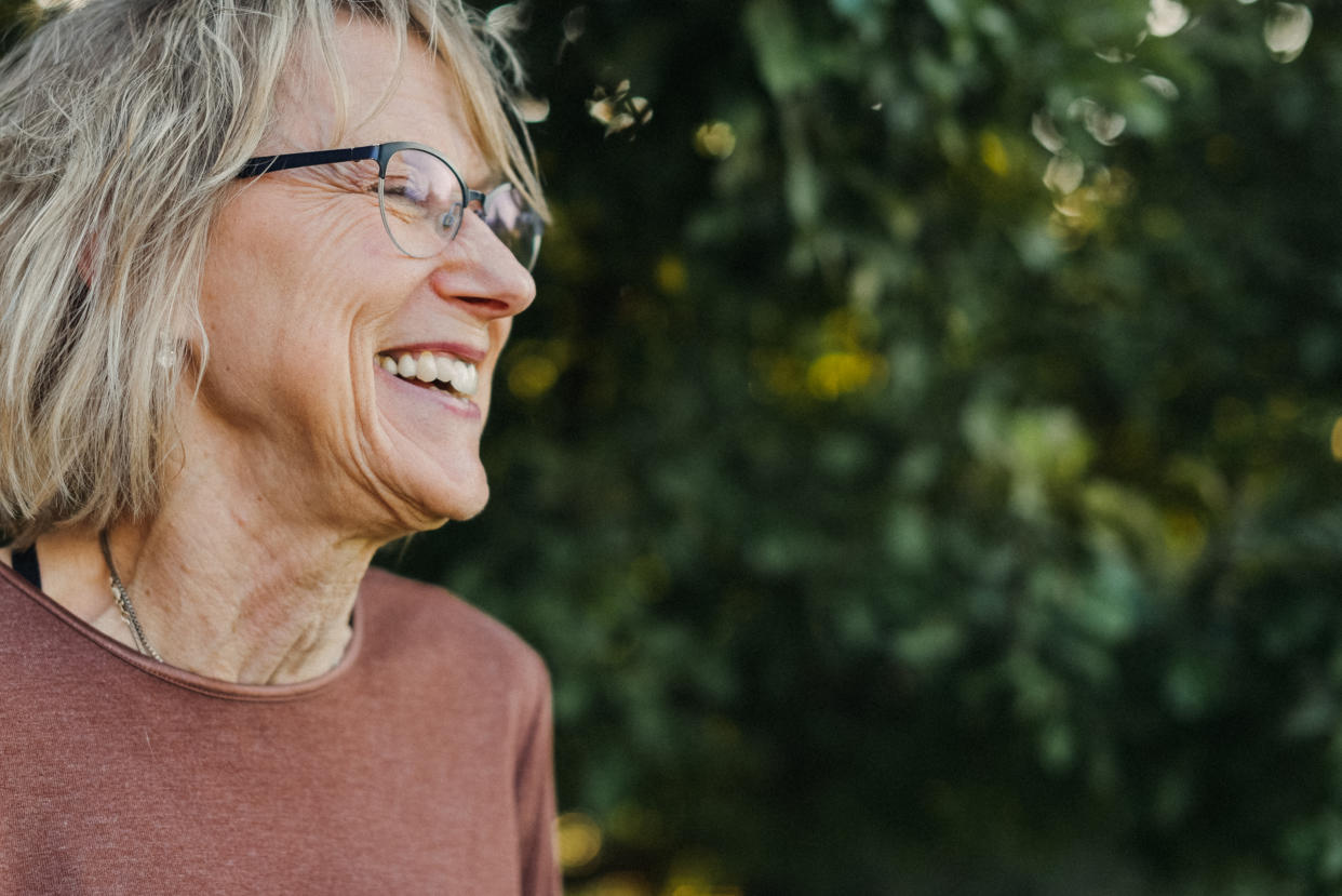 Side view of an active senior woman with blonde hair. Close up.