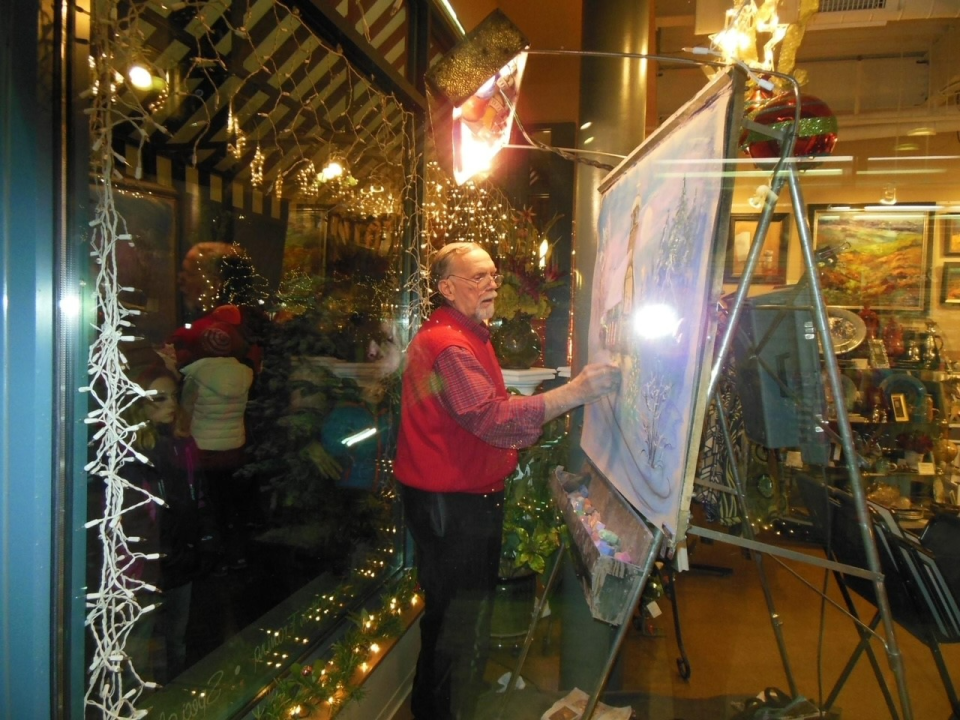 Gary Means painting at a Beaver Light-Up Night.