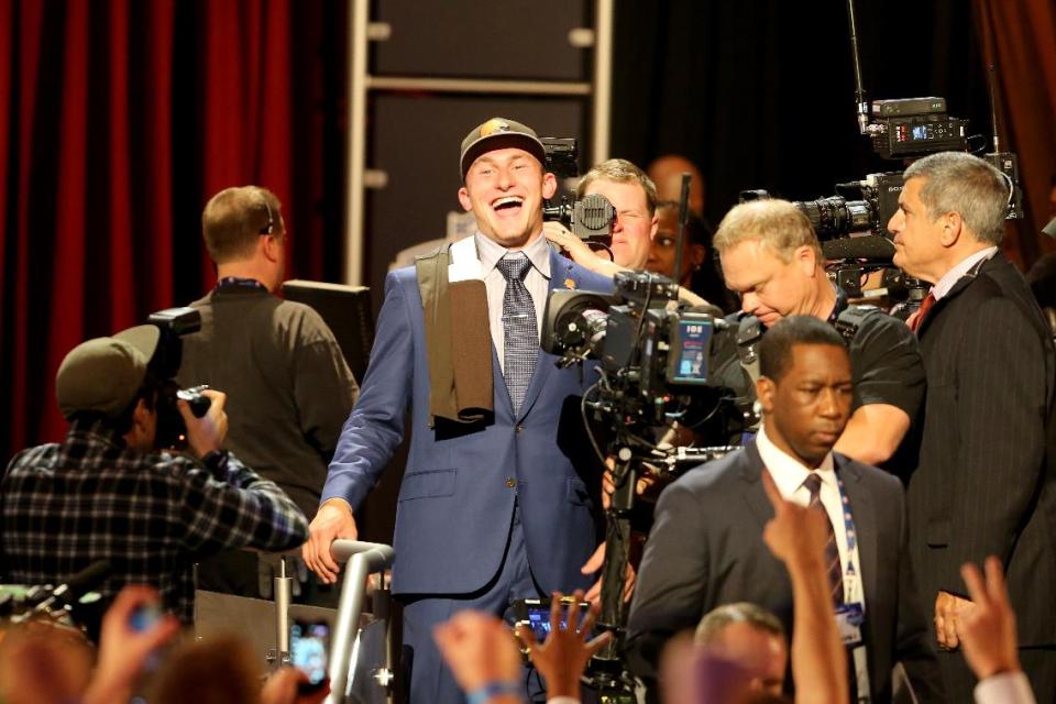 Johnny Manziel is seen leaving the stage after being selected by the Cleveland Browns at the 2014 NFL Draft at Radio City on Thursday, May 8th, 2014 in New York, NY. (AP Photo/Gregory Payan)