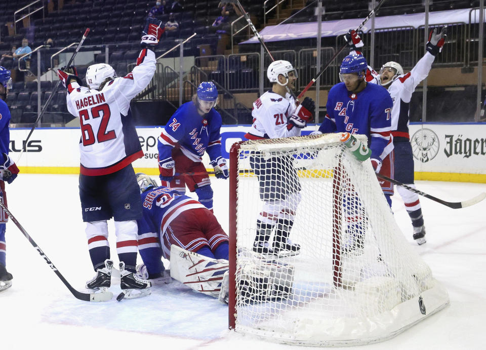 Garnet Hathaway, far right, of the Washington Capitals, celebrates his goal second period against the New York Rangers during an NHL hockey game Monday, May 3, 2021, in New York. (Bruce Bennett/Pool Photo via AP)