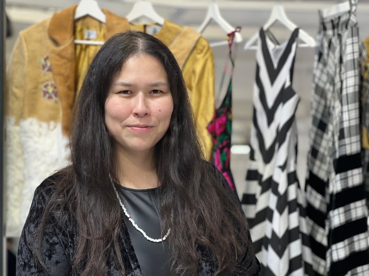 Robyn McLeod, of the Deh Gáh Got'ı̨ę First Nation in the Dehcho Region of the Northwest Territories, displays some of her designs at Milan Fashion Week in Italy. Indigenous designers from Canada are showcasing their work at the WHITE/Milan Fashion Week section for up-and-coming designers. (Megan Williams/CBC - image credit)