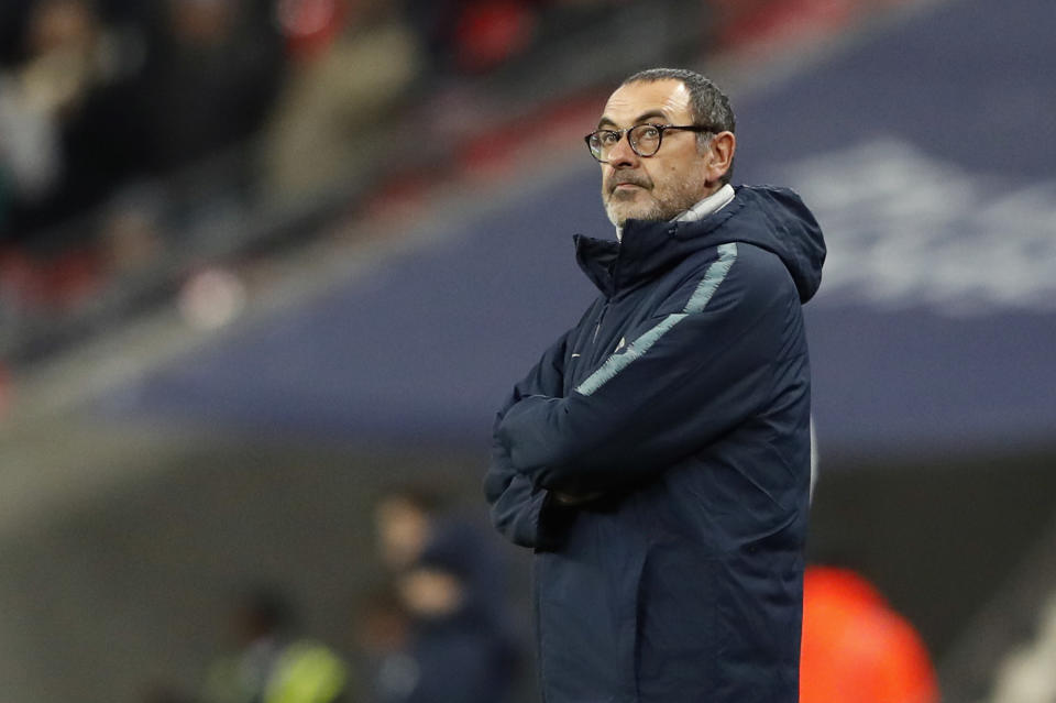 FILE - In this Tuesday, Jan. 8, 2019 file photo, Chelsea's team manager Maurizio Sarri stands on the side of the pitch prior to the English League Cup semifinal first leg soccer match between Tottenham Hotspur and Chelsea at Wembley Stadium in London. Amid reports of an imminent move to Chelsea and a mysterious fever, Gonzalo Higuain again lost his cool against his former club in what could have been his last match for AC Milan. Higuain was on the bench for most of Wednesday's Italian Super Cup against Juventus, officially due to "fever", but came on for the final 20 minutes. (AP Photo/Frank Augstein, File )