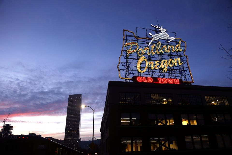 FILE - This Jan. 27, 2015, file photo, shows the "Portland, Oregon" sign in downtown Portland, Ore. Portland is again expected to be a flashpoint because of a right-wing rally planned Saturday, Aug. 17, 2019, in the liberal city. The out-of-town groups will likely be met by anti-fascist protesters and the police will be out in force. The city has seen violent protests before. (AP Photo/Don Ryan, File)
