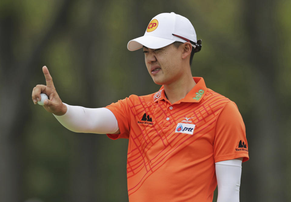 Jazz Janewattananond, of Thailand, lines up a putt on the ninth green during the final round of the PGA Championship golf tournament, Sunday, May 19, 2019, at Bethpage Black in Farmingdale, N.Y. (AP Photo/Charles Krupa)