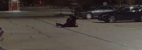 This screenshot, taken from a video captured by a NBC4 employee, shows a Westerville police officer attempting to arrest a theft suspect outside the Meijer store on Polaris Parkway. The video appears to show the officer beating the man while he is on the ground.