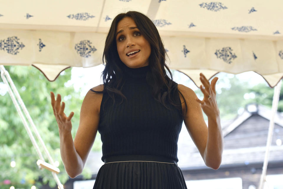 Meghan, the Duchess of Sussex, welcomes the women involved with the cookbook "Together" during a reception at Kensington Palace, in London, Thursday Sept. 20, 2018. The Duchess was joined by her mother Doria Ragland and husband Prince Harry for the launch of a cookbook aimed at raising money for victims of the Grenfell fire. (Ben Stansall/Pool Photo via AP)