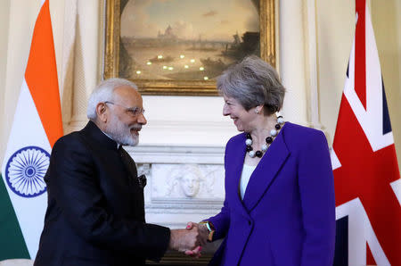 Britain's Prime Minister Theresa May shakes hands with India's Prime Minister Narendra Modi during a bilateral meeting at 10 Downing Street in London, Britain, April 18, 2018. Kirsty Wigglesworth/Pool via Reuters