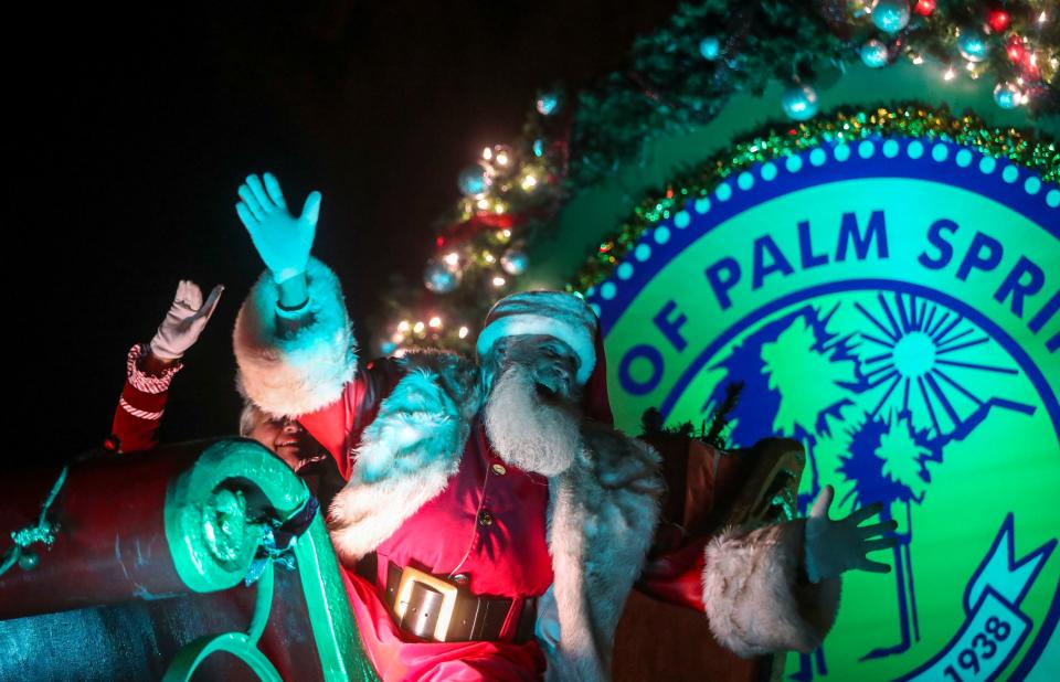 Mr. and Mrs. Claus bring up the end of the Festival of Lights Parade, Saturday, Dec. 4, 2021, in Palm Springs, Calif. 