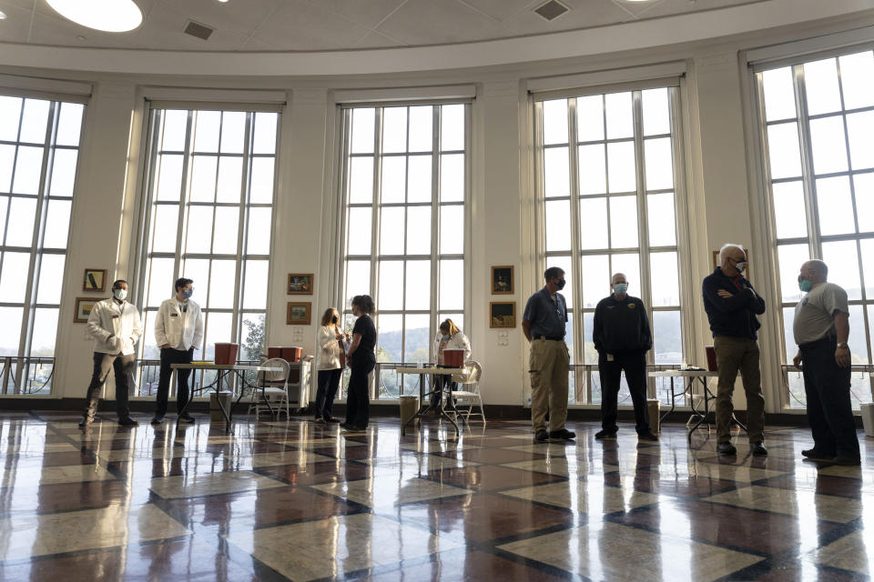 Medical professionals wait for the first students to arrive, during a vaccination event in Riggleman Hall on the campus of the University of Charleston on April 8, 2021. (Stephen Zenner / SOPA Images/LightRocket via Getty Images file)