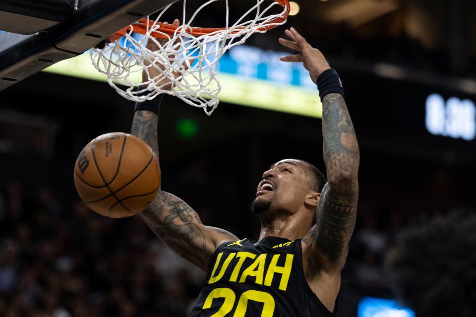 Utah Jazz forward John Collins (20) dunks the ball during a game against the Golden State Warriors at the Delta Center in Salt Lake City on Monday, Feb. 12, 2024. | Marielle Scott, Deseret News