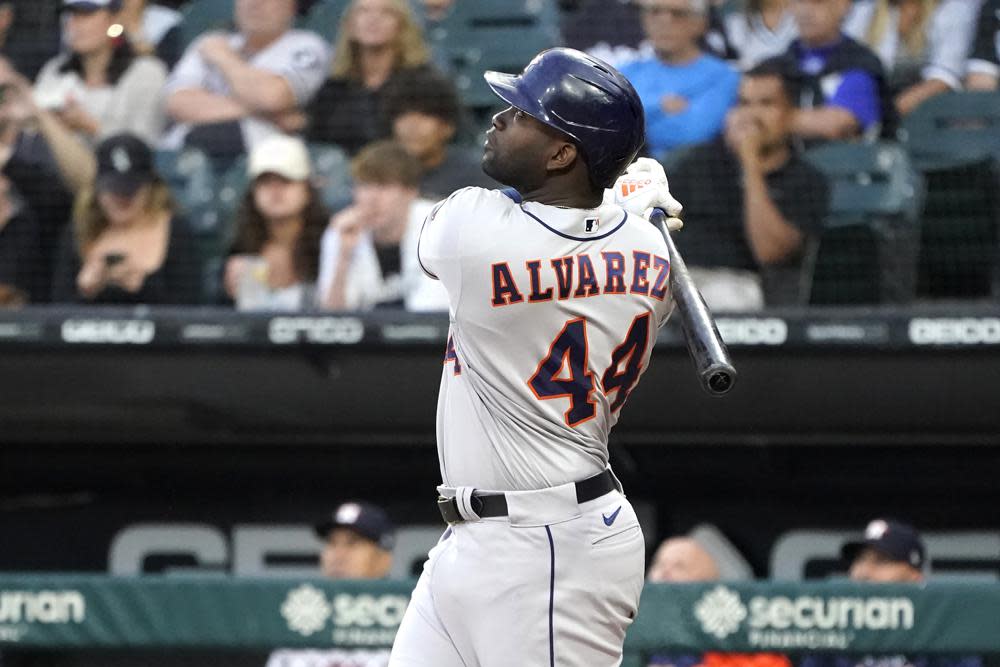 Houston Astros’ Yordan Alvarez watches his sacrifice fly off Chicago White Sox starting pitcher Johnny Cueto during the first inning of a baseball game Monday, Aug. 15, 2022, in Chicago. (AP Photo/Charles Rex Arbogast)