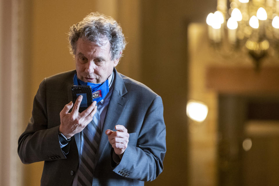 WASHINGTON, DC - MARCH 06: Sen. Sherrod Brown (D-OH) takes a call at the US Capitol on March 06, 2021 in Washington, DC. The Senate passed the latest COVID-19 relief bill by 50 to 49 on a party-line vote, after an all-night session.  (Photo by Tasos Katopodis/Getty Images)