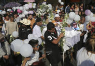 The casket of 7-year-old murder victim Fatima is taken from her home to a church for a funeral Mass in Mexico City, Tuesday, Feb. 18, 2020. The girl was taken from her school by a stranger on Feb. 11, and found dead four days later in a bag in a rural area. (AP Photo/Marco Ugarte)