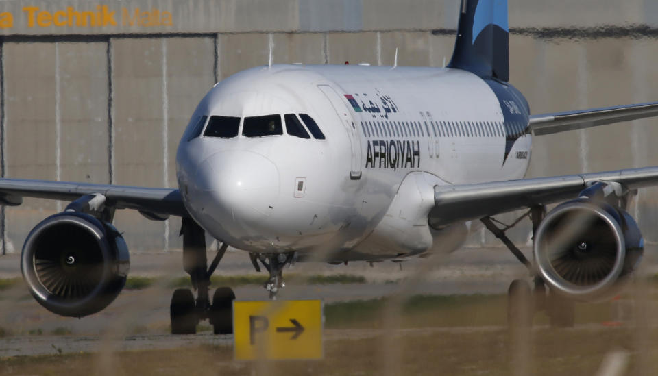 A hijacked Libyan Afriqiyah Airways Airbus A320 stands on the runway at Malta Airport