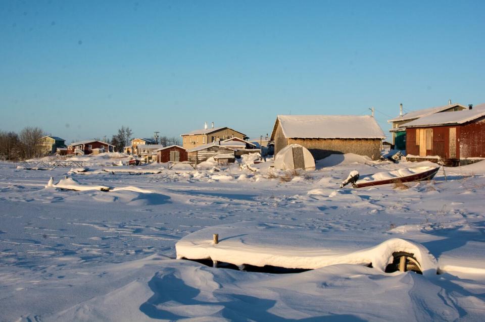 A file photo of Whatì, N.W.T., in the winter. The community experienced 3 power outages on Sunday due to issues with a new generator.  (Mark Rendell/CBC - image credit)