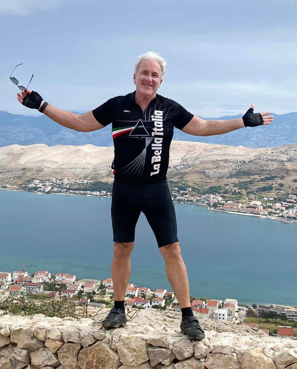 Destin resident Tom Catanese poses for a photo overlooking the Adriatic Sea on an island in Croatia while bicycling 2,000 miles through the Balkans region of Europe.