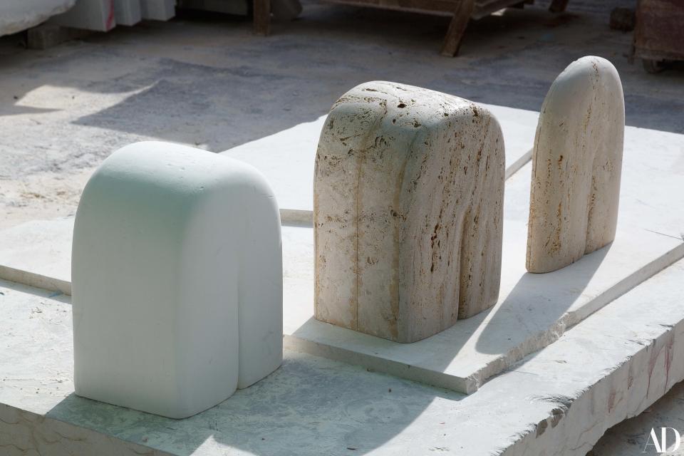 A trio of sandstone and travertine works in progress at the stone yard.