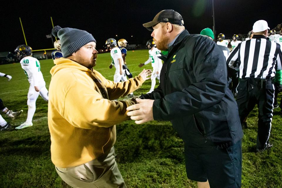 New Prairie head coach Casey McKim and Northridge head coach Chad Eppley shake hands after the New Prairie vs. Northridge regional championship football game Friday, Nov. 11, 2022 at New Prairie High School in New Carlisle.