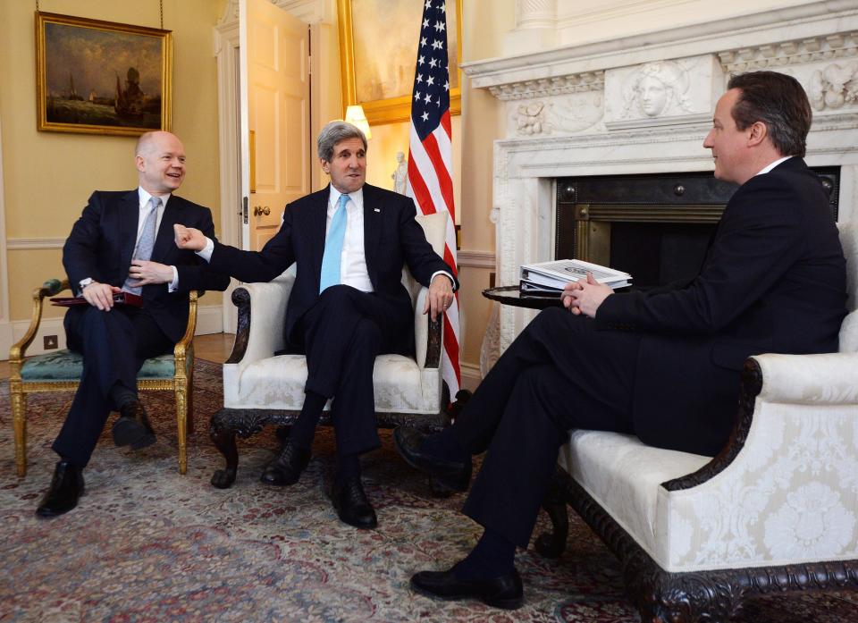 British Prime Minister David Cameron (R) and Foreign Secretary William Hague (L) meet with U.S. Secretary of State John Kerry (C) in Downing Street in central London on March 14, 2014. Kerry arrived in London on an 11th-hour mission to head off a possible Russian annexation of Crimea on the heels of a breakaway vote by the Ukrainian region. (Photo credit should read BEN STANSALL/AFP/Getty Images)