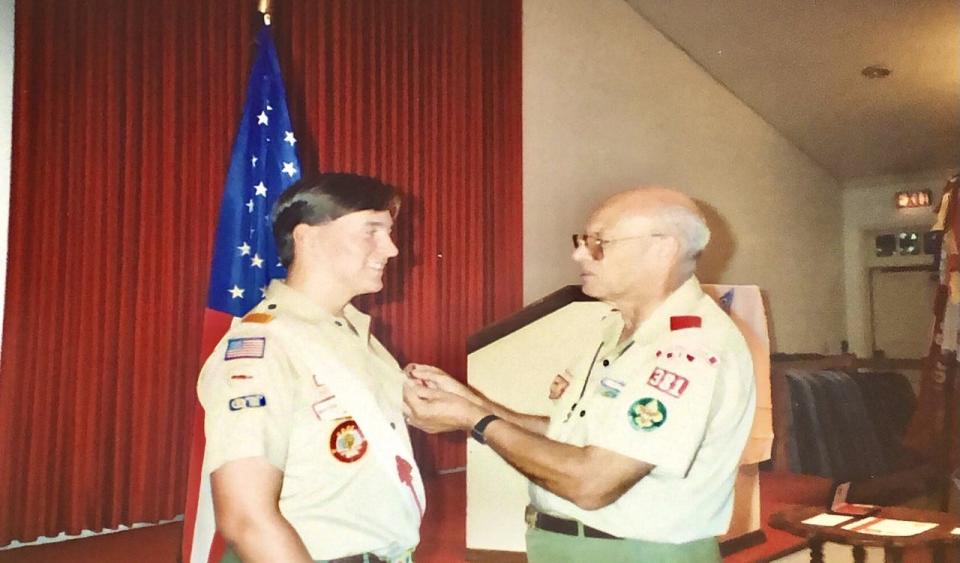 Mick Gillispie is awarded the rank of Eagle Scout.