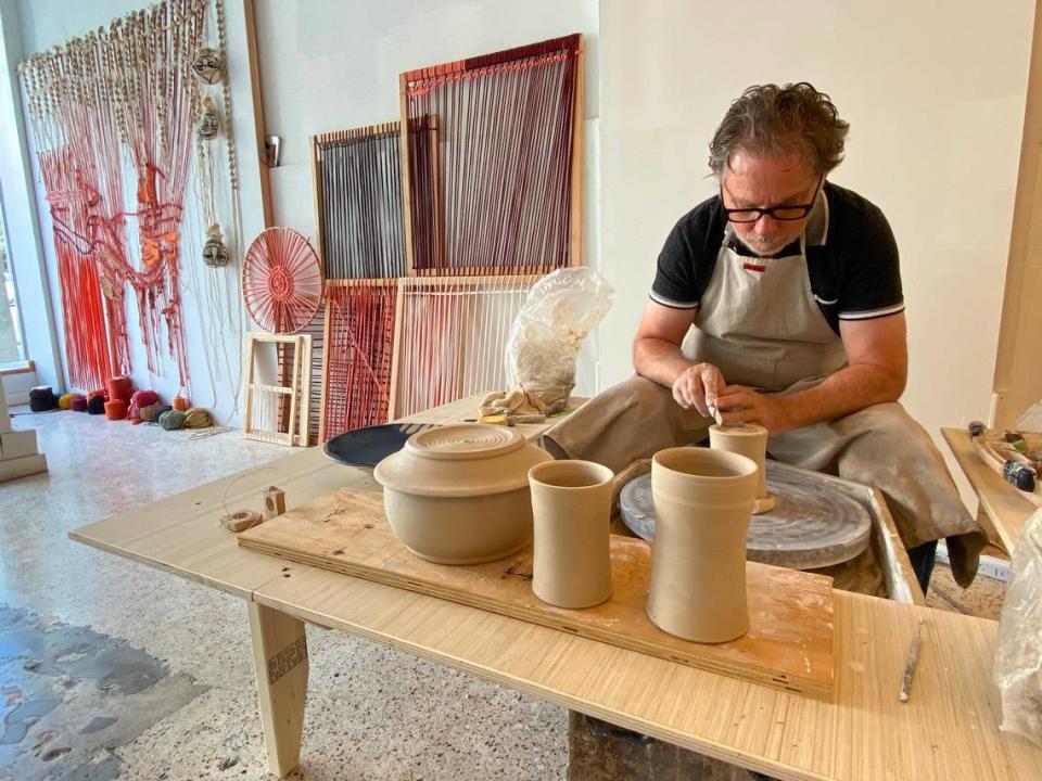 Empty spaces along Coral Gables’ Miracle Mile have been filled this December with studios of working artists, including James Herring.