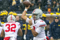 Ohio State quarterback C.J. Stroud (7) throws a pass in the second quarter of an NCAA college football game against Michigan in Ann Arbor, Mich., Saturday, Nov. 27, 2021. (AP Photo/Tony Ding)