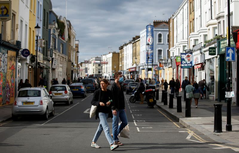 People walk in Portobello Road where Carnival is normally held annually, amid the coronavirus disease (COVID-19) outbreak, in London