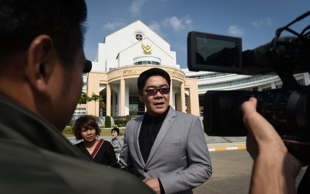 Lawyer Kong Suriyamontol speaks to the press after his client, Mitsutoki Shigeta, wins paternity rights to the 13 children he fathered through Thai surrogates - AFP