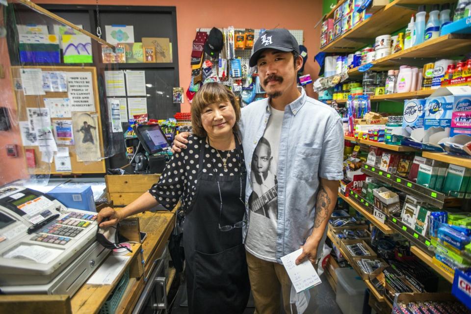 May Park, left, with her son Danny Park, at the Skid Row People's Market in Los Angeles, CA.