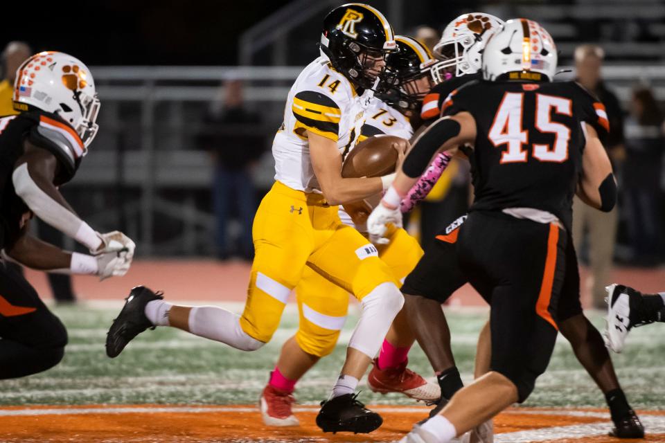 Red Lion quarterback Christopher Price (14) keeps the ball as he runs toward the end zone to score a touchdown during a YAIAA Division I football game against Central York at Central York High School on Friday, Oct. 14, 2022.