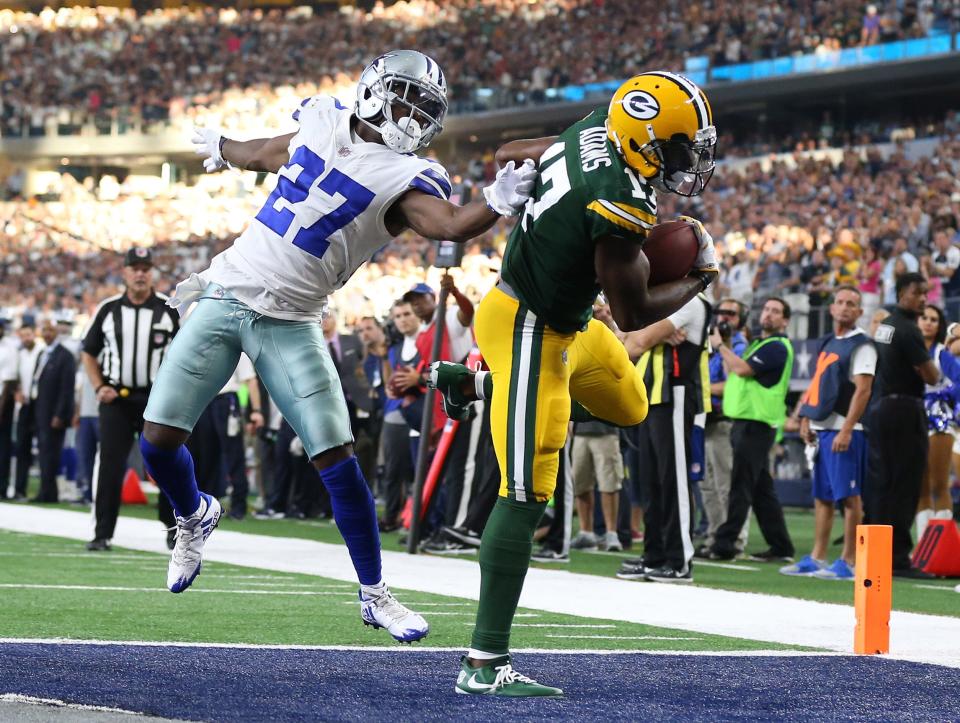 Green Bay Packers wide receiver Davante Adams scores a fourth quarter touchdown against Dallas Cowboys cornerback Jourdan Lewis on Oct 8, 2017.