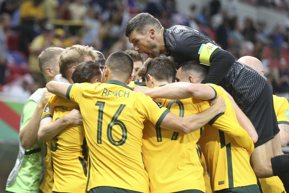 Australia's players celebrate after a goal during a qualifying match between United Arab Emirates and Australia in Al Rayyan, Qatar, Tuesday, June 7 2022. (AP Photo/Hussein Sayed)