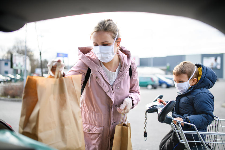 Masks will be necessary to protect yourself and others against the spread of COVID-19 as your body responds to the vaccine. (Photo: Halfpoint Images via Getty Images)