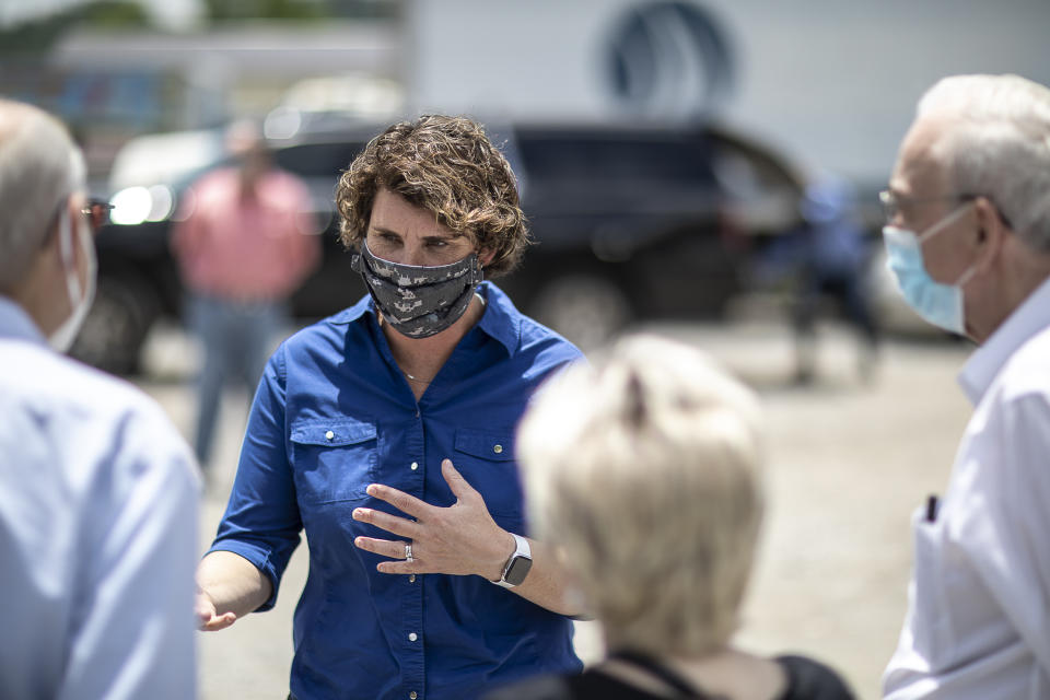 U.S. Senate candidate Amy McGrath speaks to people during a visit to Thankful Hearts Food Pantry in Pikeville, Ky., Monday, June 22, 2020. (Ryan C. Hermens/Lexington Herald-Leader via AP)