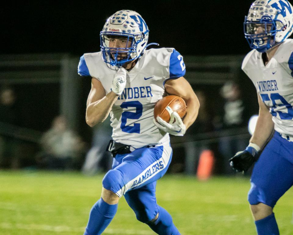 Windber running back John Shuster races 80 yards for a touchdown on Windber's opening drive of the District 5 Class 1A championship game, Nov. 10, in Bedford.