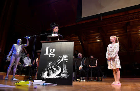 "Miss Sweetie Poo," played by Dorothea Hartig, right, demonstrates to Master of Ceremonies Marc Abrahams how she will let award recipients know that their speech is going too long, with her repeated phrase, "I'm bored" during the 27th First Annual Ig Nobel Prize Ceremony at Harvard University in Cambridge, Massachusetts, U.S. September 14, 2017. REUTERS/Gretchen Ertl