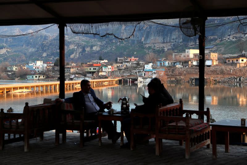 People rest at a tea house by the Tigris River that will be submerged by the waters of Ilisu Dam in Hasankeyf