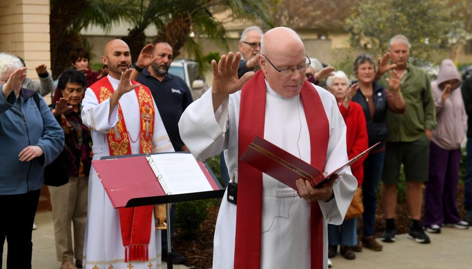 Monsignor Leon Hutton blesses a healing garden at Our Lady of the Assumption Church in Ventura on Tuesday.