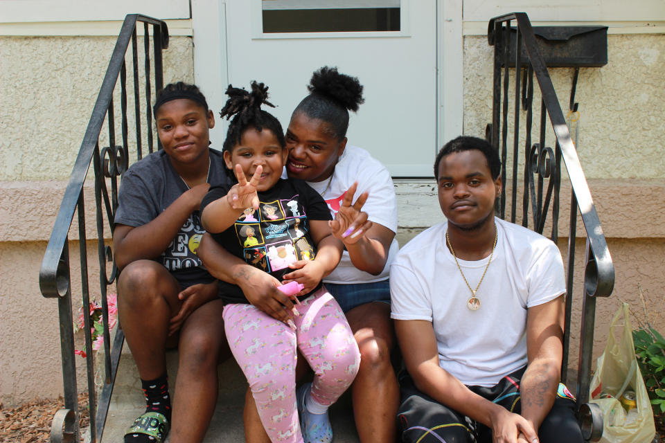 Jimari Brown, Center, poses with her family, from left, Je’Nye Brown, 17, Jai’Brieanne Brown, 3, and Jameatrius Bailey, 18. (Michelle Cho / NBC News)