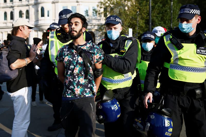 People gather in Trafalgar Square to protest against the lockdown imposed by the government, in London