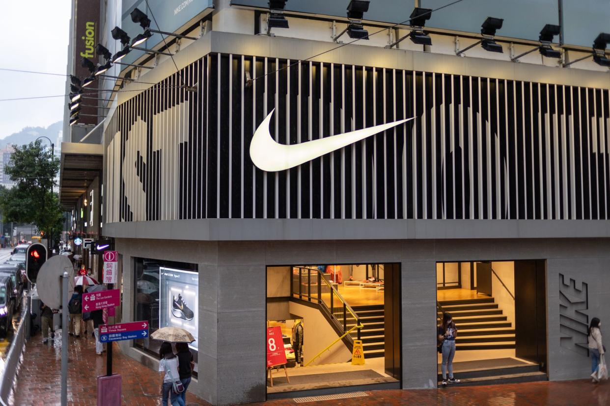 People walk past the Nike Running store at Causeway Bay in Hong Kong.