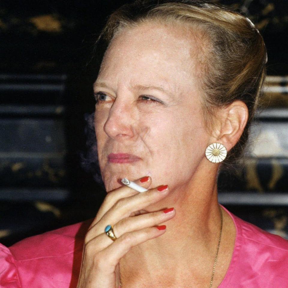 Queen Margrethe II of Denmark smokes a cigarette in this Sept. 16, 1991 - Joergen Jessen/AP