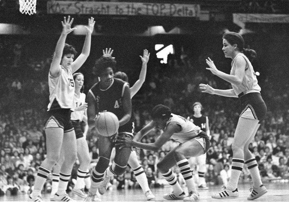 Delta State's Lusia Harris drives through the Louisiana State defense during the AIAW basketball championship game in Minneapolis, Minn., March 26, 1977. Delta State won, 68-55. (AP File Photo, Jim Mone, AP)