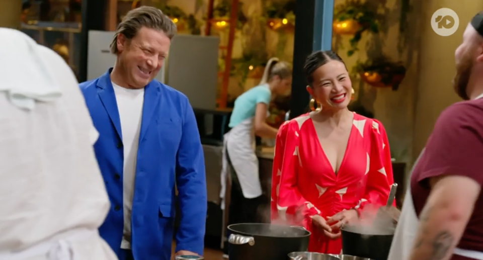 Jamie Oliver and Po talking to a MasterChef contestant.