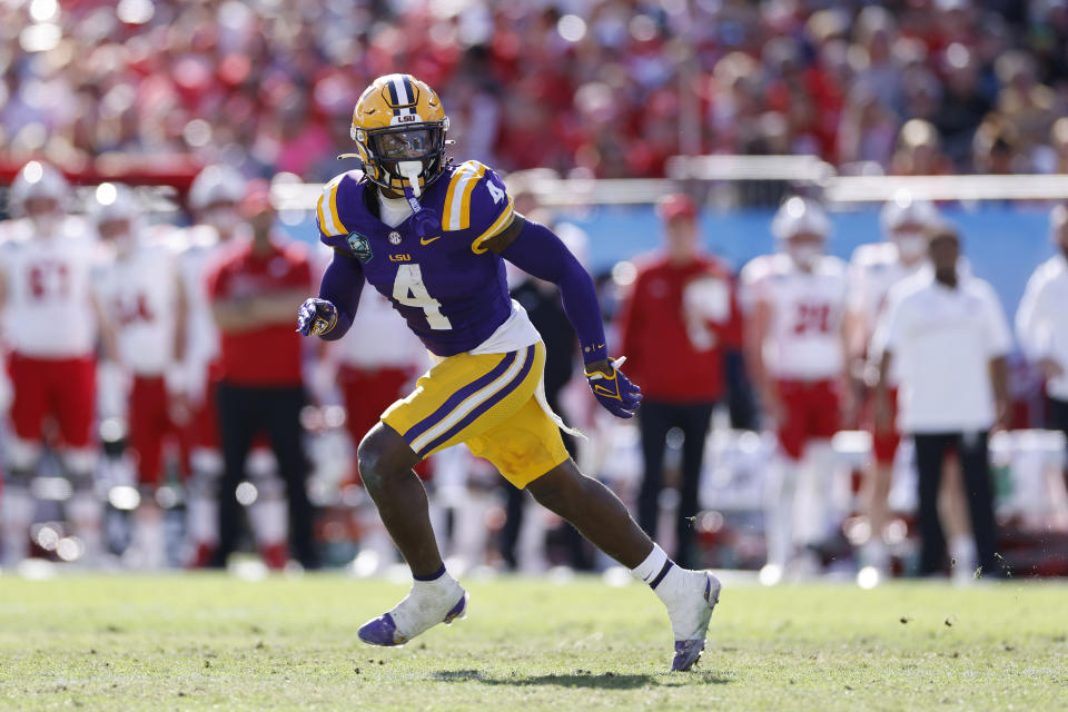 TAMPA, FL - JANUARY 01: LSU Tigers linebacker Harold Perkins Jr. (4) pursues a play on defense during the ReliaQuest Bowl against the Wisconsin Badgers on January 1, 2024 at Raymond James Stadium in Tampa, Florida. (Photo by Joe Robbins/Icon Sportswire via Getty Images)