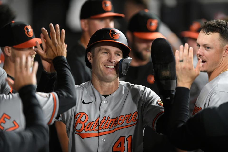 Baltimore Orioles' Tyler Nevin (41) celebrates with teammates in the dugout after scoring on a Cedric Mullins single during the ninth inning of the team's baseball game against the Chicago White Sox on Thursday, June 23, 2022, in Chicago. The Orioles won 4-0. (AP Photo/Paul Beaty)