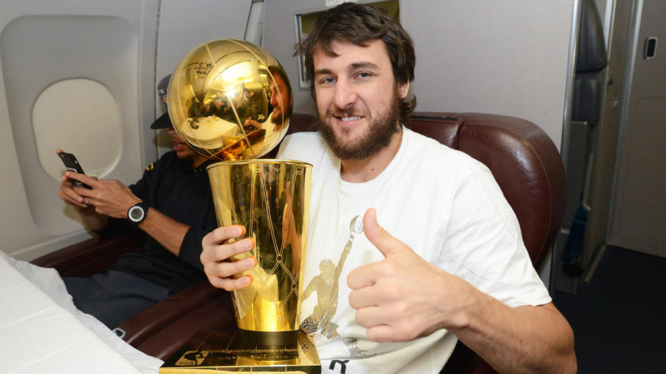 Andrew Bogut is pictured with the NBA Larry O'Brien championship trophy in 2015.