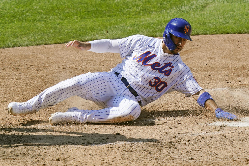 New York Mets Michael Conforto (30) scores on a fielding error by Philadelphia Phillies third baseman Alec Boem during the fifth inning of a baseball game, Sunday, Sept. 6, 2020, in New York. (AP Photo/Kathy Willens)