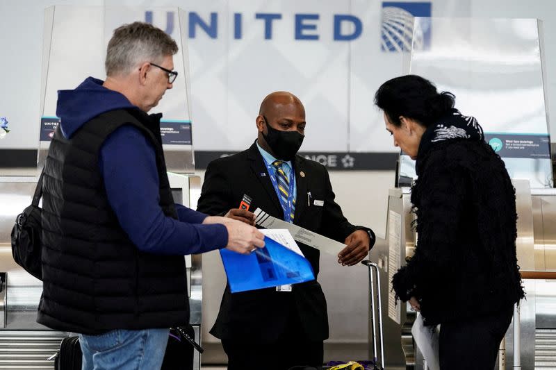 FILE PHOTO: FILE PHOTO: Air travel resumes amid lifting of COVID-19 mask mandate at Reagan National Airport in Arlington, Virginia